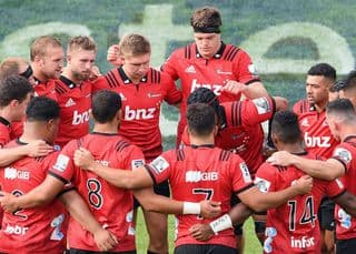 The Crusaders huddle during the 2019 Super Rugby season. Photo: Kai Schwoerer/Getty Images
