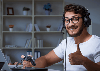 happy guy playing PC game