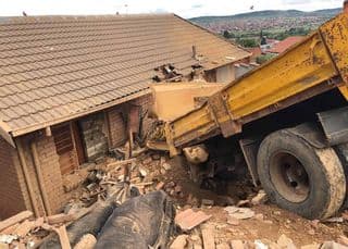 Watch: Truck rams into houses,