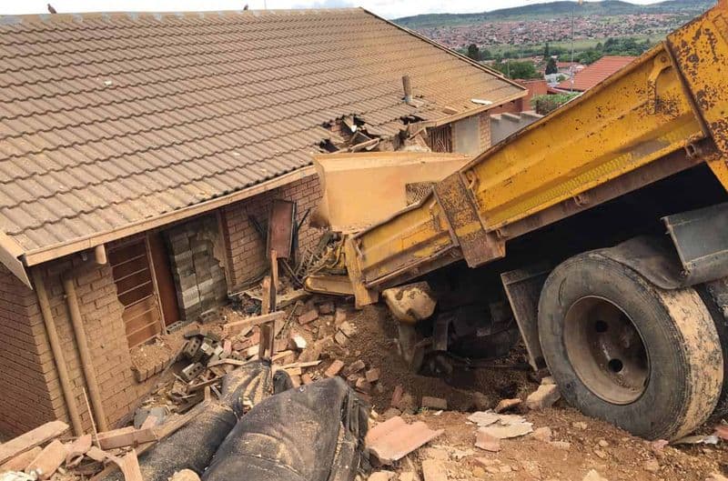 Watch: Truck rams into houses,