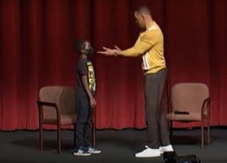 An old clip shows Will Smith teaching a young boy how to 'fake slap'
