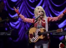 Rock hall of fame inducts Dolly Parton despite her rejection
